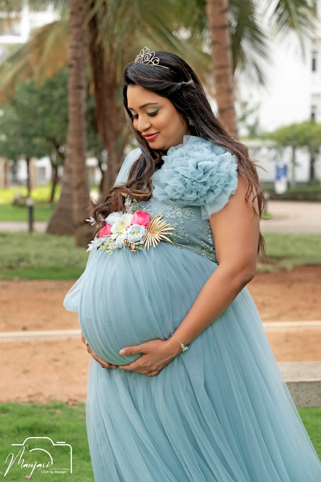 Outdoor maternity portrait in a soft blue gown