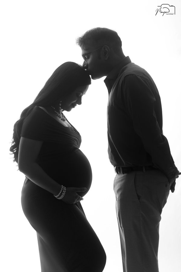 Black and white maternity portrait of an expectant couple